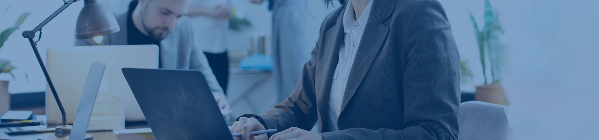 A woman and a man working on laptop