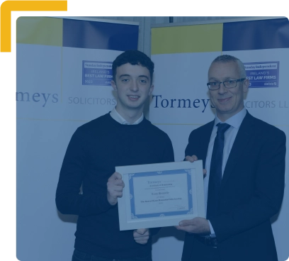 Pictured at the Scholarship presentation is Joint Second Place Winner, Liam Hennelly, past pupil of Athlone Community College, pictured with Patrick Flynn (Son of Scholarship founder, Barra Flynn).