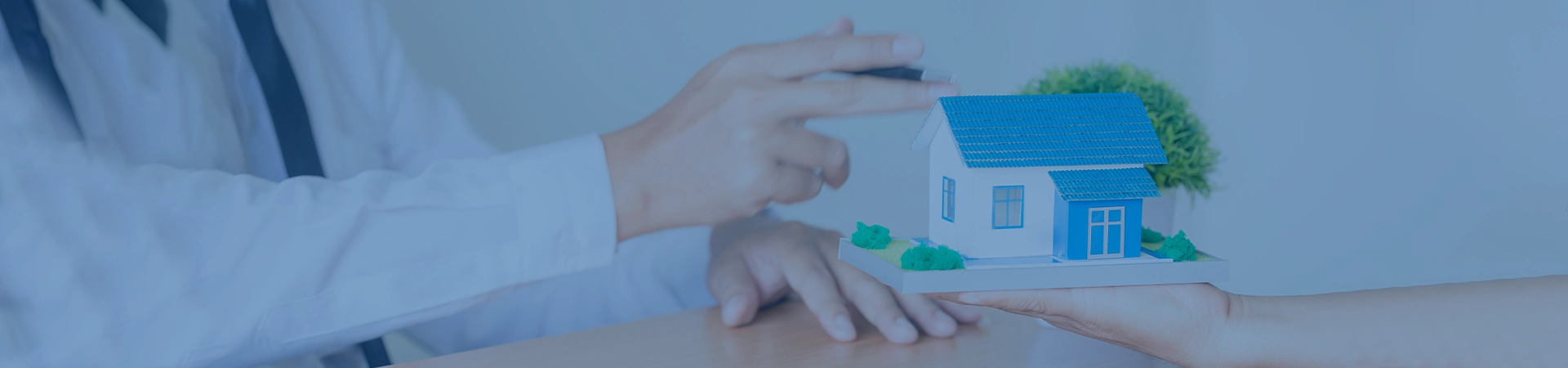 Real Estate Agent with House Model